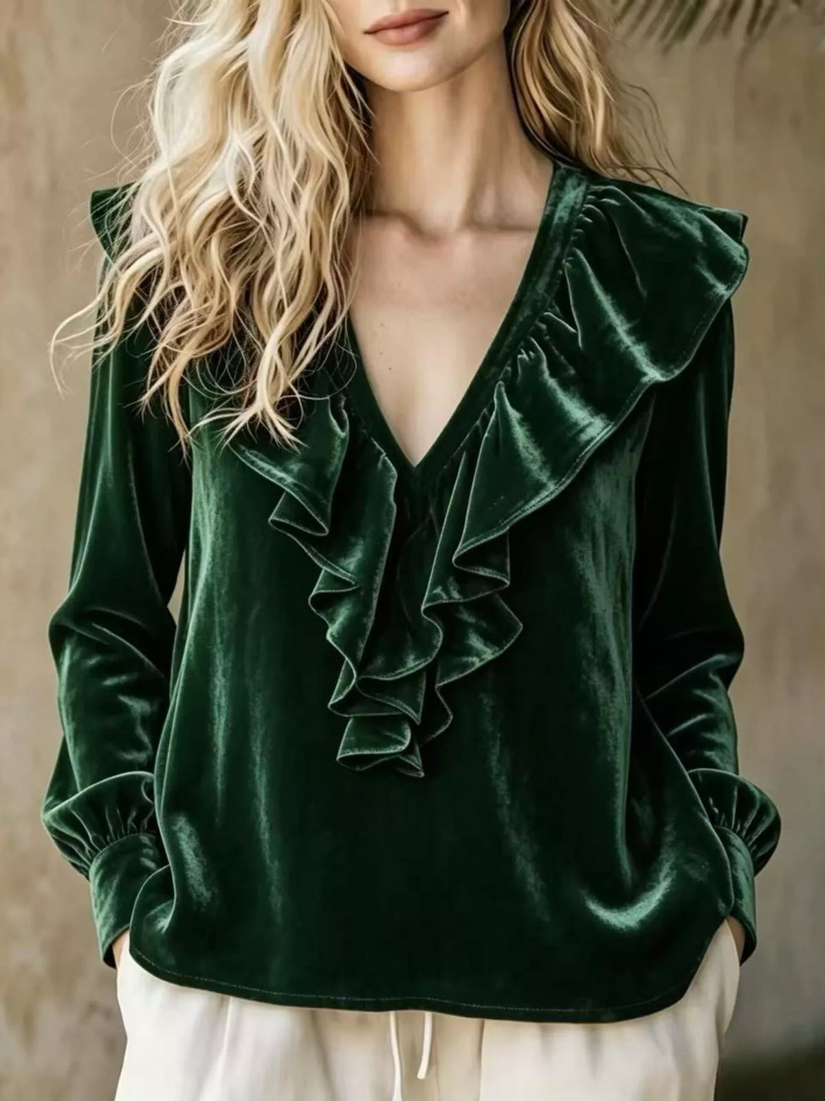 Plus size long sleeve V-neck ruffled blouse from Trendsi, shown in full size, featuring a stylish V-neck and delicate ruffle details.