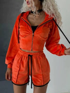 Trendsi zip-up hooded outerwear and shorts set, featuring a matching jacket with hood and casual shorts for a stylish, relaxed look.
