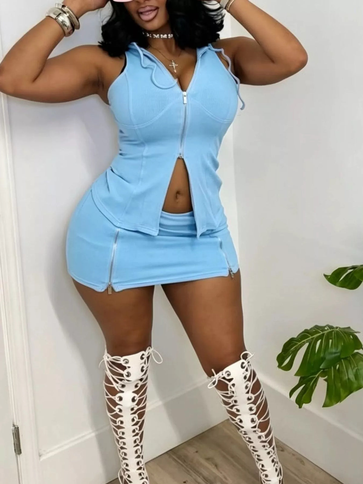 Plush Fashion Hub hooded zippered sleeveless top and skirt set, stylish two-piece outfit for casual or sporty wear.