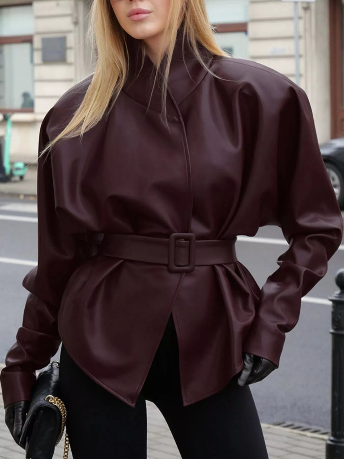 Women's faux leather jacket with stand collar and belt, trendy jacket by Trendsi, shown in black with sleek design.