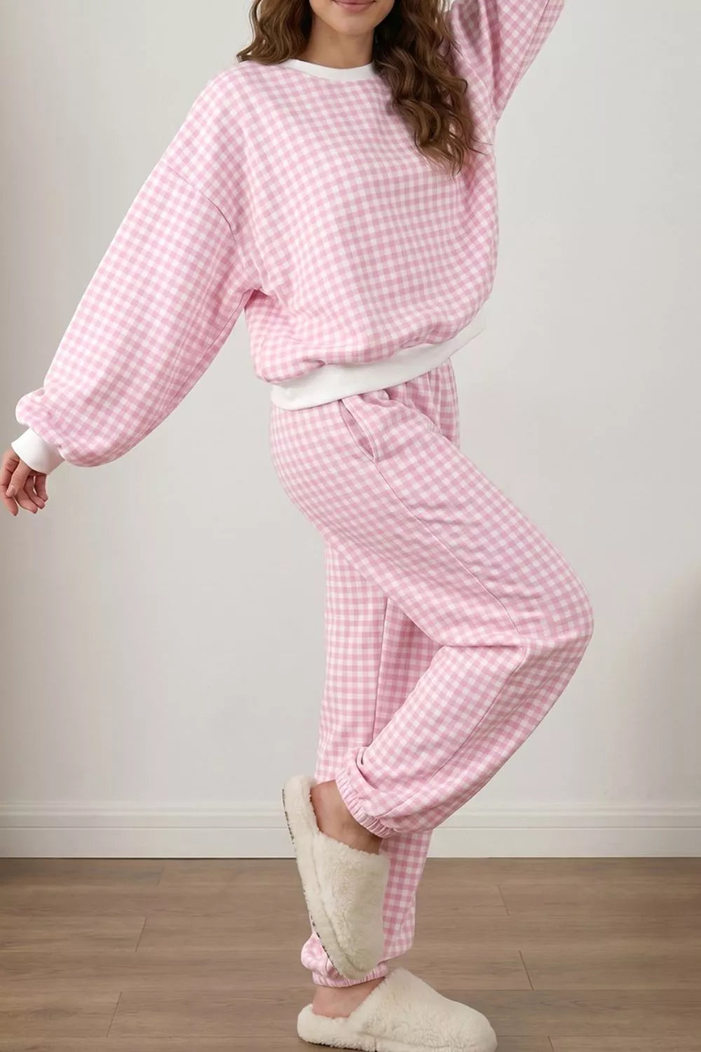 Women’s gingham round neck top and pants set by Trendsi, featuring a stylish matching two-piece outfit in a classic pattern.