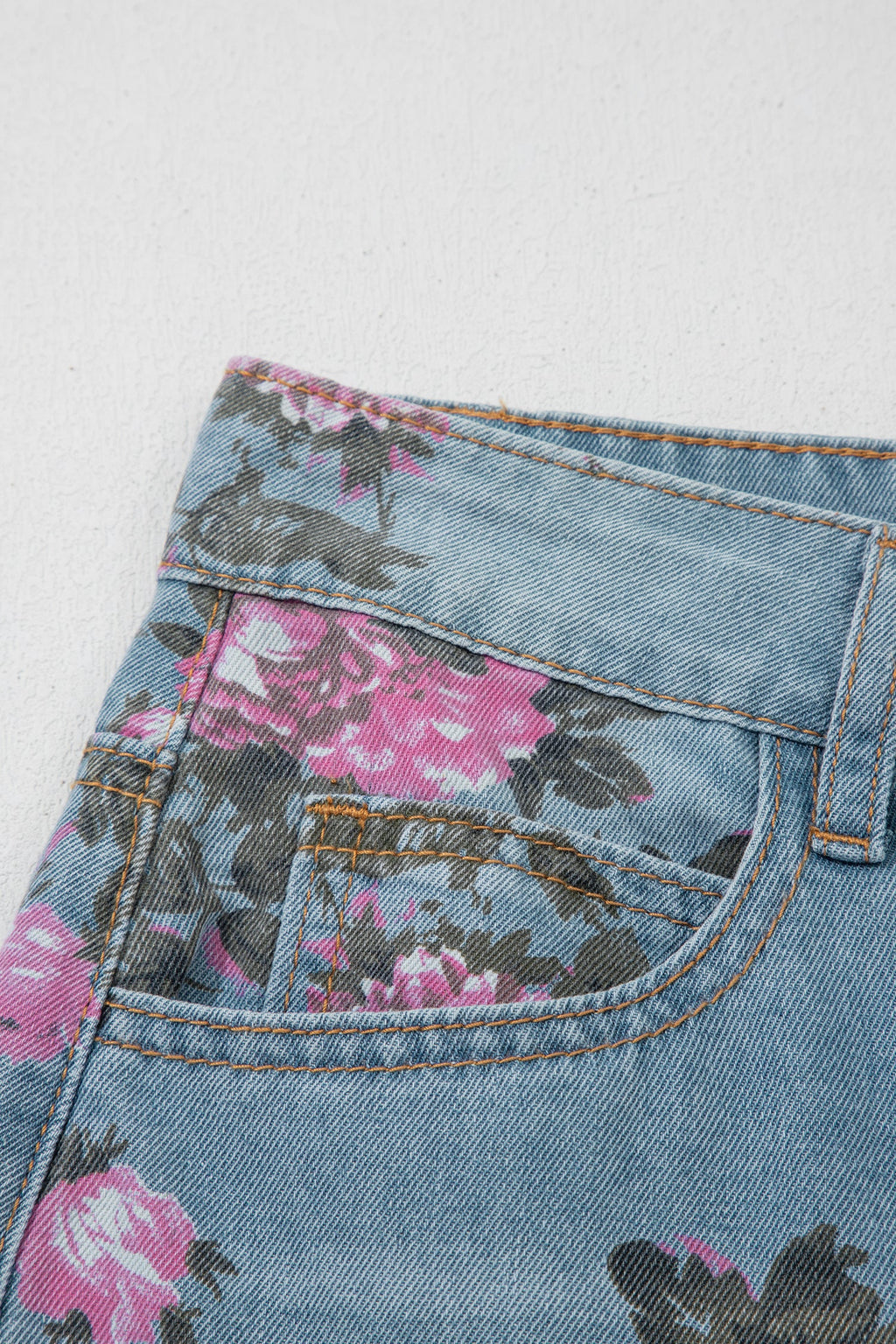 Esme floral print bootcut jeans by Threaded Pear featuring vibrant floral patterns and classic denim fit.
