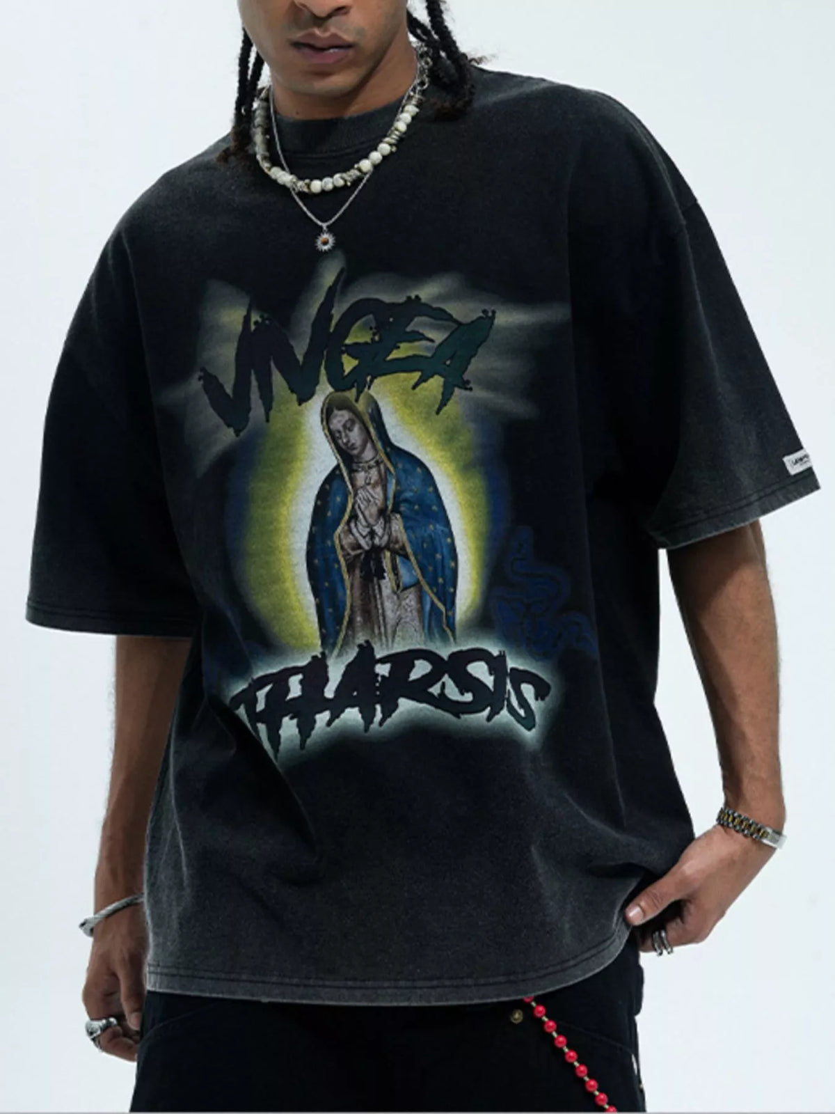 Men's graphic round neck short sleeve T-shirt from Trendsi, featuring a bold design on soft fabric, perfect for casual wear.
