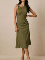 Asymmetrical neck ruched midi dress by Trendsi featuring a stylish design with a fitted silhouette and elegant ruching details.