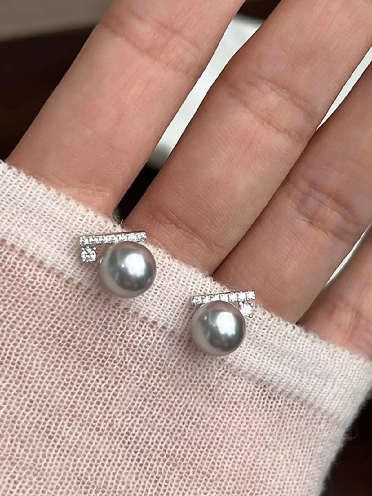 Elegant Zircon and Pearl Stud Earrings with silver settings, featuring sparkling stones and lustrous pearls for sophisticated style.