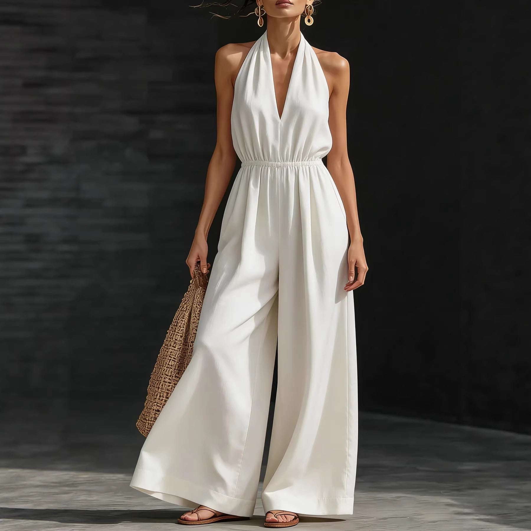 Women’s V-neck halter neck wide-leg jumpsuit by FitiqueFit, shown in a casualwear style, featuring a V-neck and flowing wide-leg design.