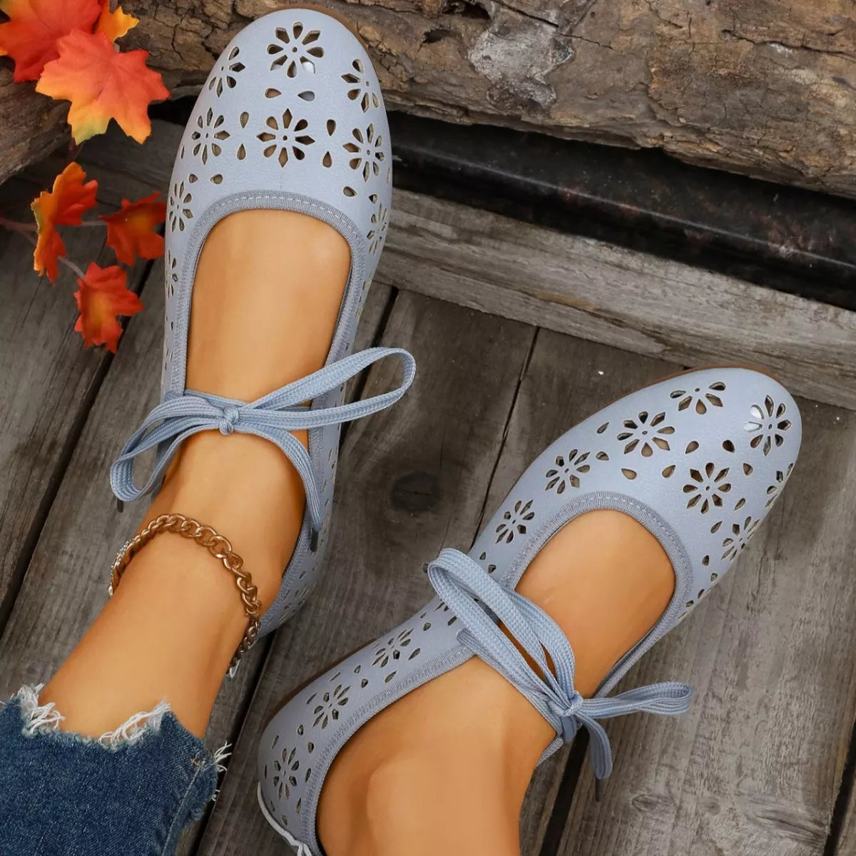 Floral cutout tied slip-on sandals by Plush Fashion Hub featuring open toe design and stylish floral accents.