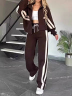 Plus size contrast stripe zip-up jacket and pants activewear set from Plush Fashion Hub, featuring bold stripe details and comfortable fit.
