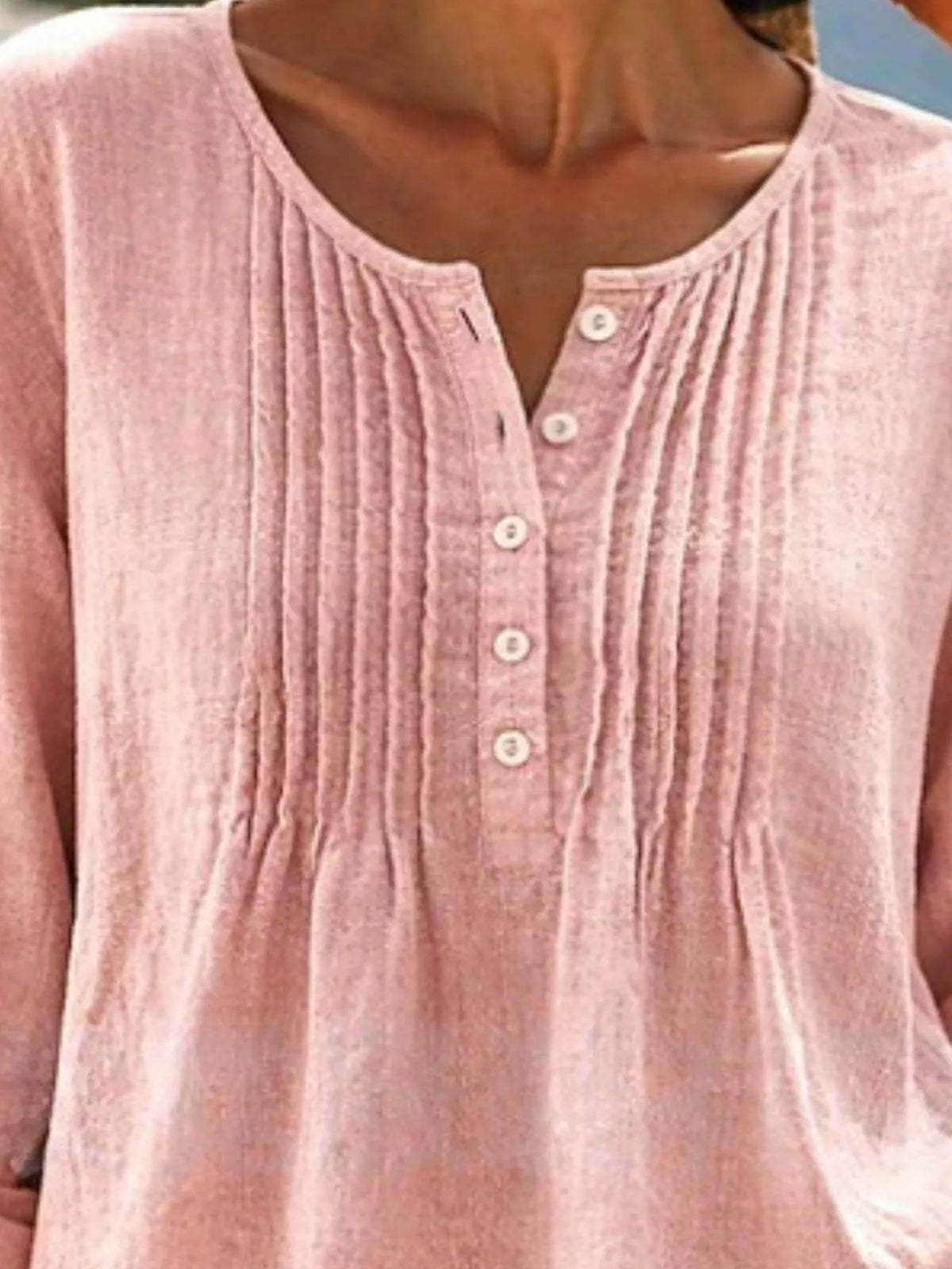 Casual long sleeve linen shirt with button details from Trendsi, featuring a relaxed fit and natural fabric texture.
