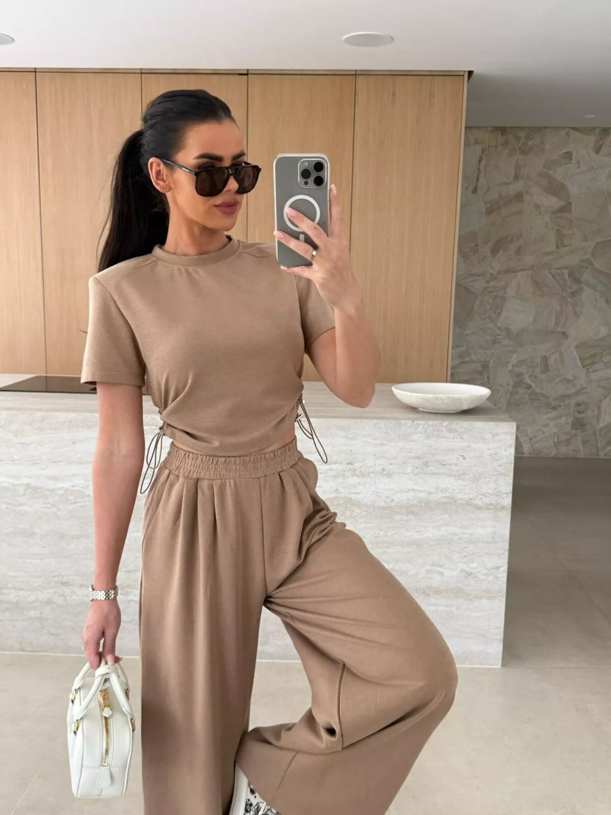 Drawstring crop top and wide-leg pants set by Plush Fashion Hub, featuring a stylish matching top and pants in soft fabric.