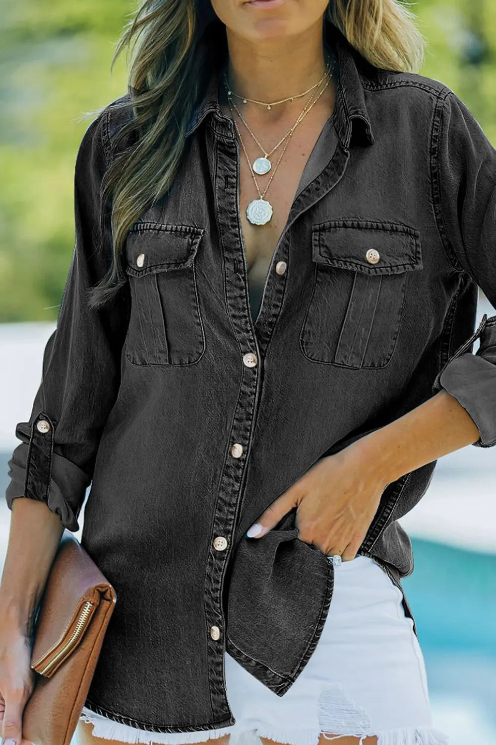 Denim top with long sleeves, collared neck, and pockets, styled as denim jeans from Trendsi with visible stitching and pocket details.