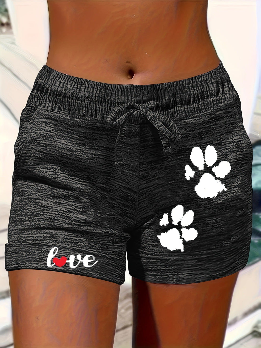 Women's printed elastic waist cropped shorts with pockets, casualwear from Plush Fashion Hub, shown in navy with floral pattern.