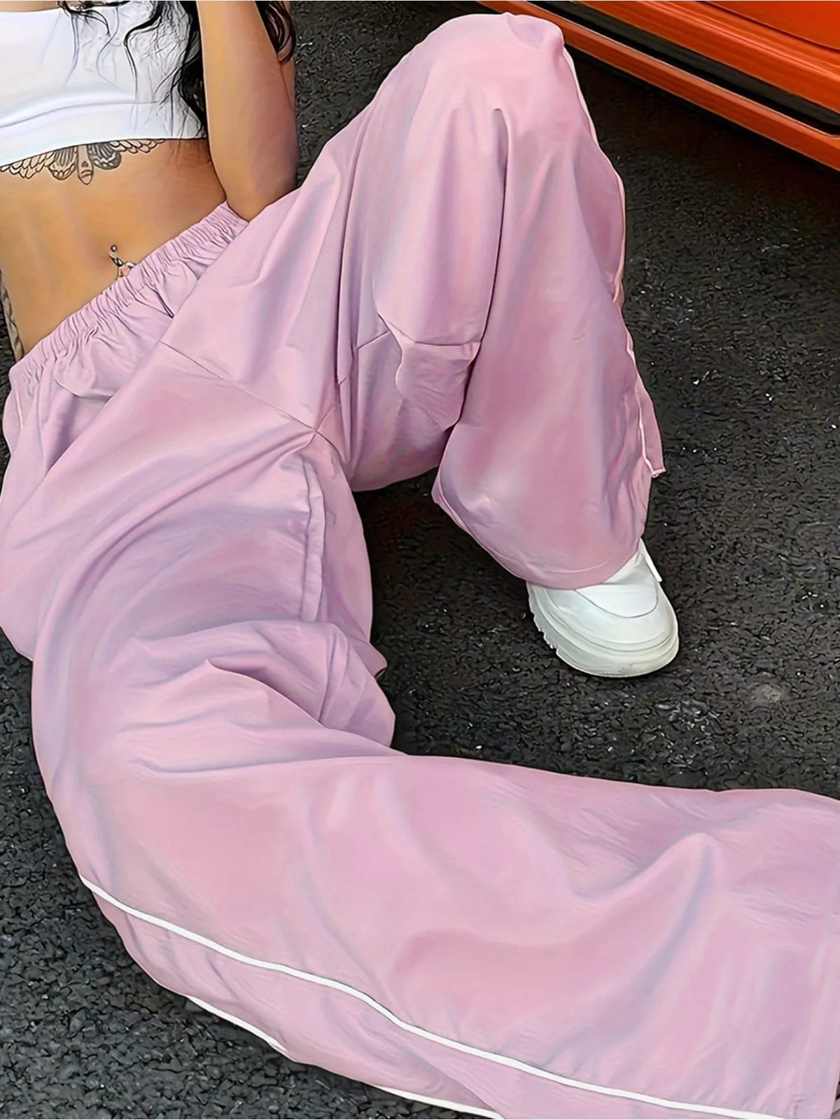 Women's lightweight high-rise wide-leg pants with elastic waist from Plush Fashion Hub, shown as a comfortable, stylish dress.