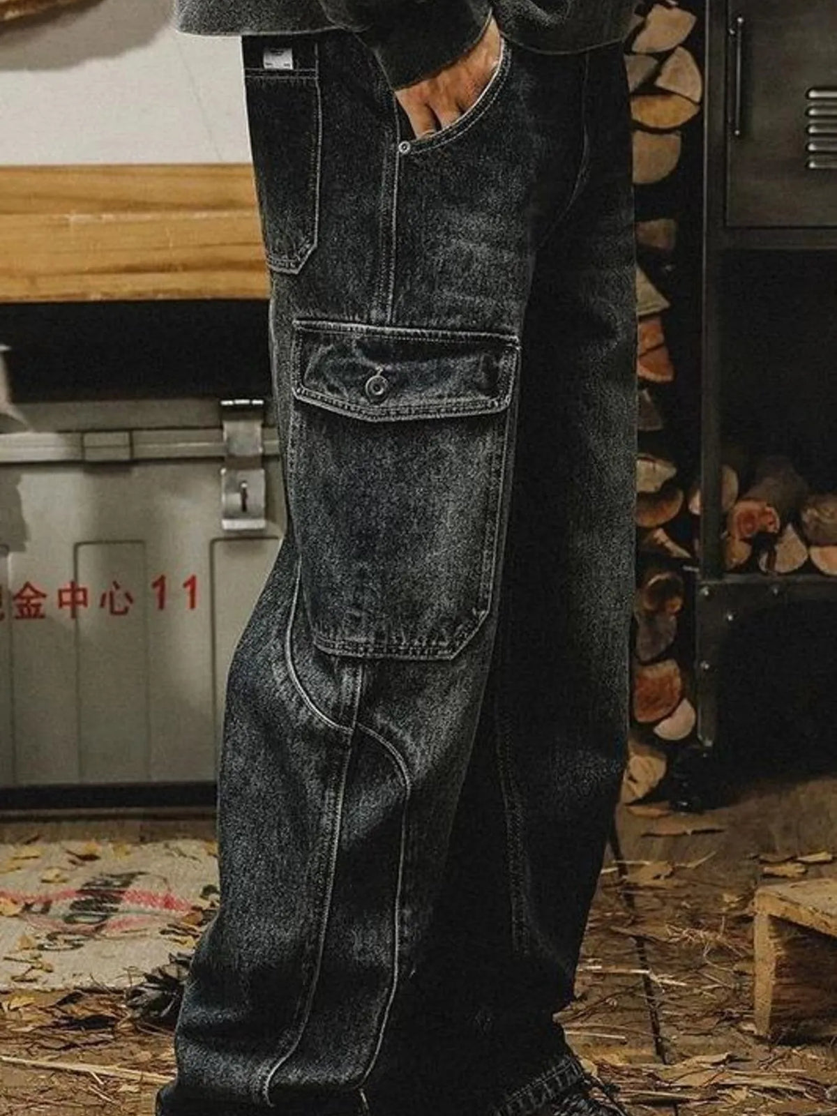 Men's washed wide leg cargo jeans by Plush Fashion Hub, showing relaxed fit with multiple cargo pockets and distressed denim detail.