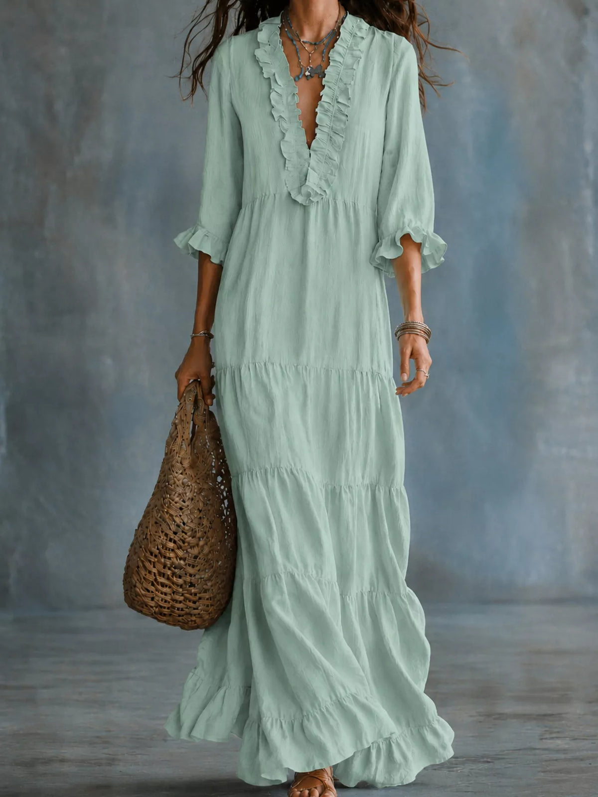 Ruffled V-neck tiered maxi dress in flowing fabric, featuring layered tiers and a stylish V-neck design by Trendsi.