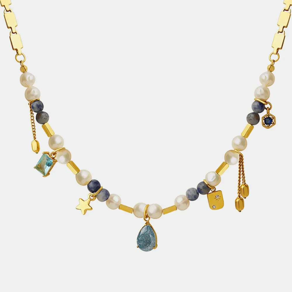 18K gold-plated beaded charm necklace with delicate beads and small charms, designed for elegant fashion accessories.