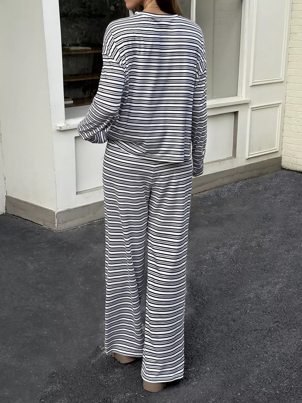 Women’s striped casual long sleeve top and wide-leg pants set by Trendsi, featuring a comfortable, stylish matching outfit.