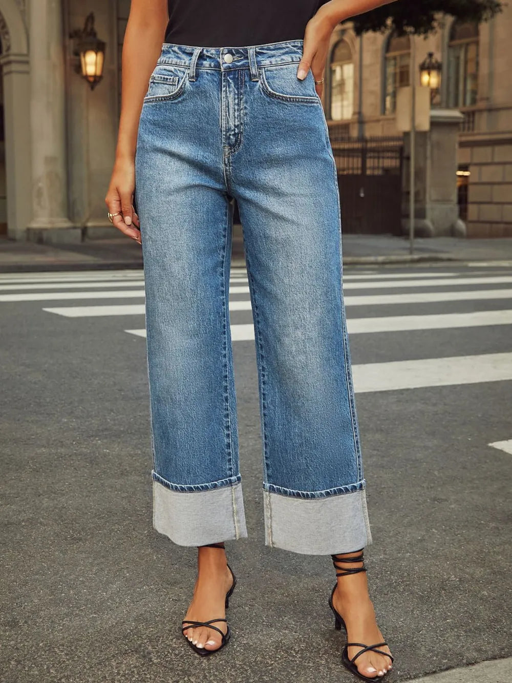 Trendsi high-waisted straight-leg rolled denim jeans, classic blue wash, front pockets, and belt loops on a model.