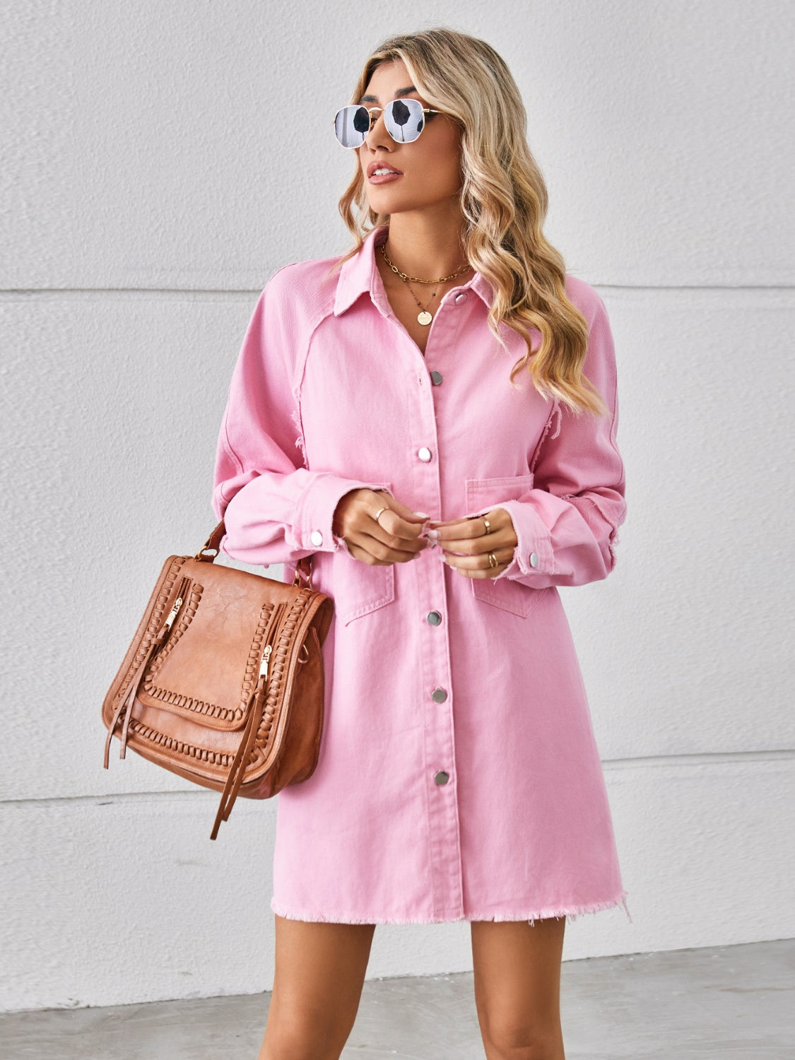 Raw hem button-up denim dress by Plush Fashion Hub, featuring a classic fit and stylish design on a model.