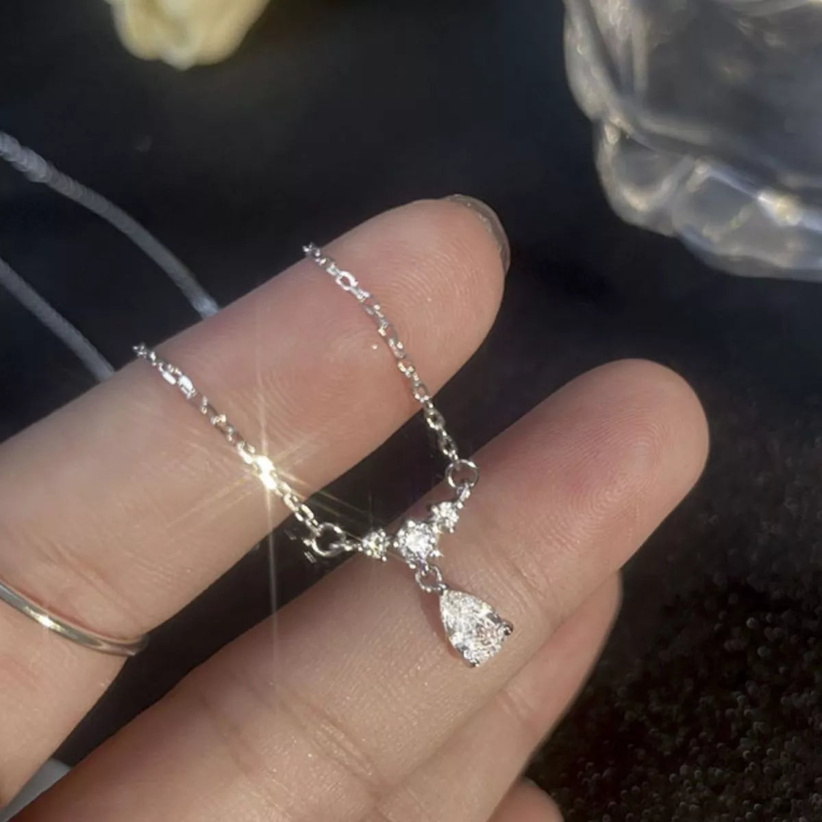 Sterling silver zircon teardrop necklace with delicate chain and sparkling pendant, stylish jewelry from Plush Fashion Hub.