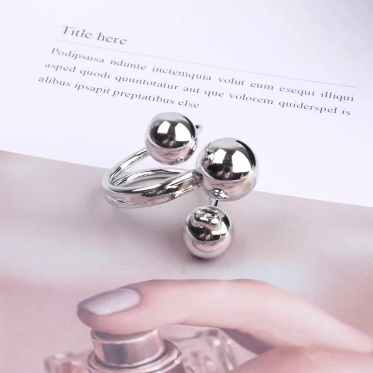 Multi-layered ball ring from Plush Fashion Hub featuring stacked silver-tone metal bands and textured ball accents.