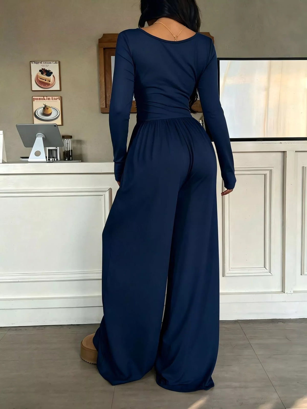 White ruched square neck wide-leg jumpsuit by Trendsi, featuring a fitted top and flowy wide-leg pants, perfect for stylish occasions.