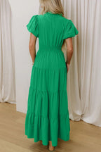Women's floral ruffled tiered puff sleeve maxi dress by Trendsi, featuring elegant long dress design with layered ruffles and puff sleeves.