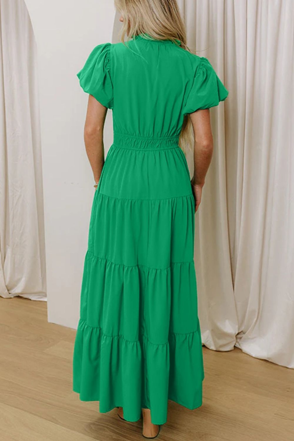 Women's floral ruffled tiered puff sleeve maxi dress by Trendsi, featuring elegant long dress design with layered ruffles and puff sleeves.