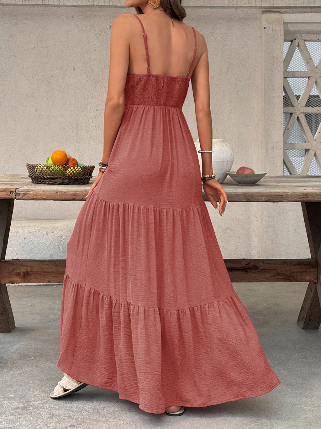 Women's deep V-neck tiered maxi dress with flowy smocked boho beach style, perfect for summer outings.