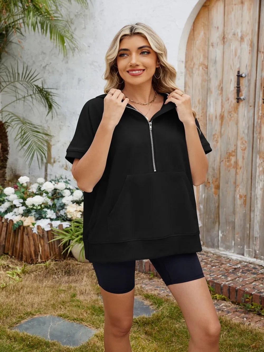 Plush Fashion Hub short sleeve hooded half zip top in soft fabric, featuring a hood and half zipper for a casual, sporty look.
