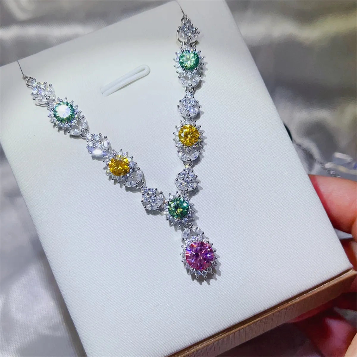 Sterling silver necklace with a 3.5 carat moissanite gemstone, elegant jewelry piece featuring a polished chain and sparkling stone.
