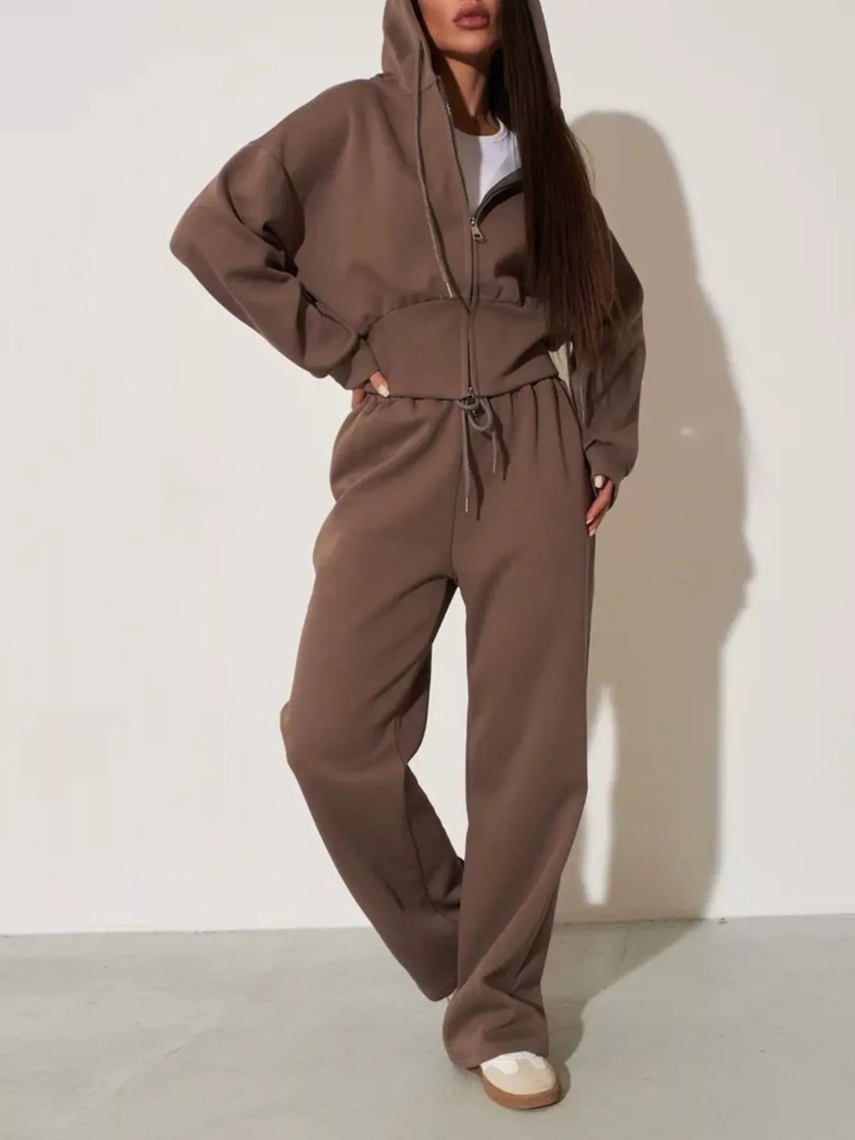 Plush Fashion Hub zip-up hoodie and wide-leg pants loungewear set, featuring comfortable fabric and casual style.