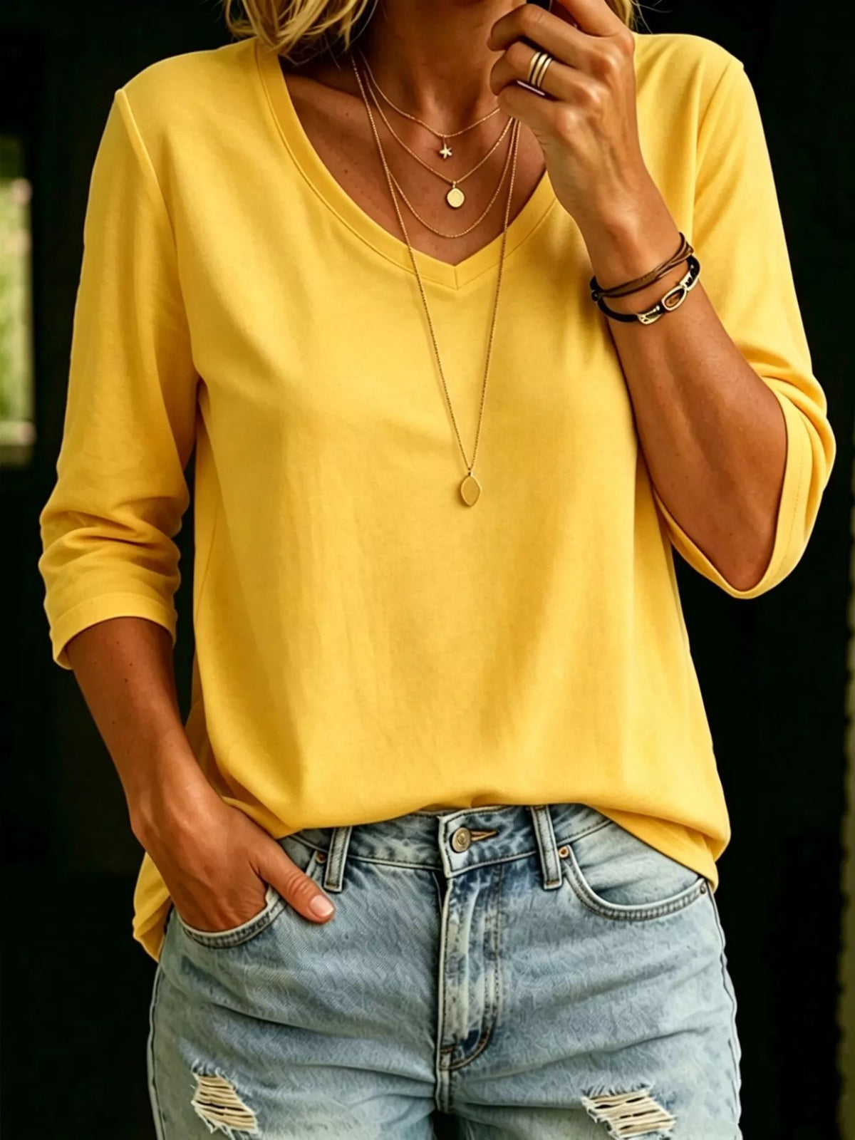Plus size V-neck T-shirt with 3/4 sleeves, full-length top from Trendsi, shown in a relaxed fit and comfortable fabric.