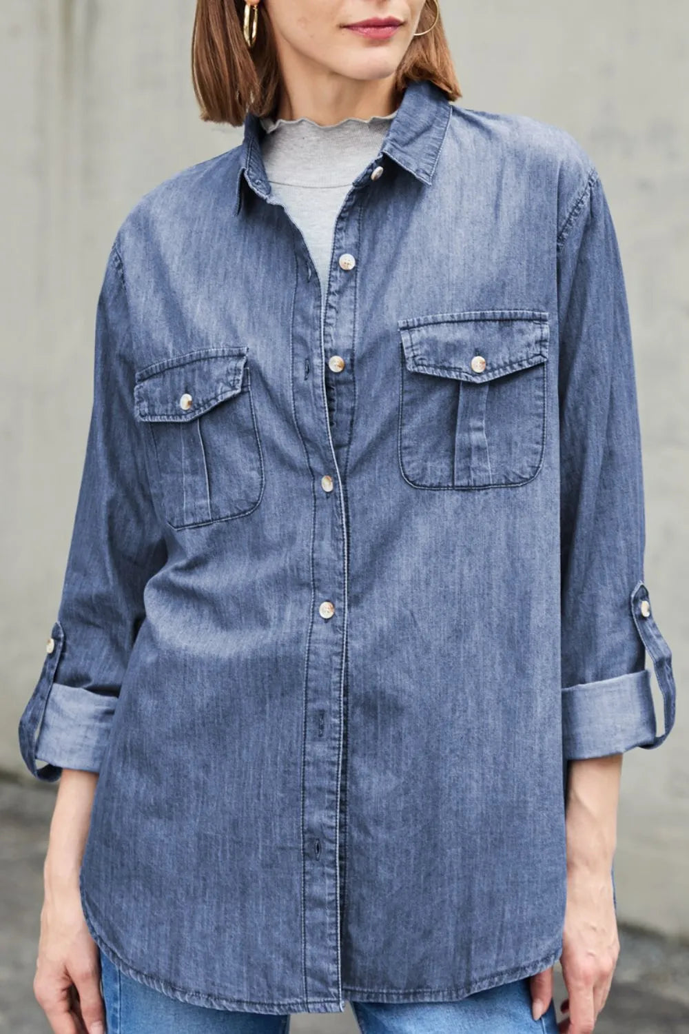 Trendsi denim top with long sleeves, collared neck, and front pockets, showcasing casual denim fashion.