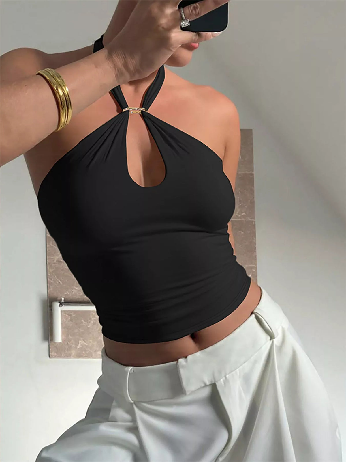 Plush Fashion Hub halter neck cami top with keyhole detail, sleeveless design, and fitted style on a neutral background.