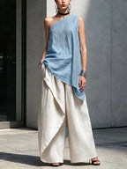 Women's one-shoulder asymmetric sleeveless top by Plush Fashion Hub, shown in a stylish, fitted design with a unique shoulder cut.