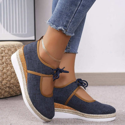 Tied Cutout Wedge Slip-Ons in blue denim with mid heel and comfortable fit.