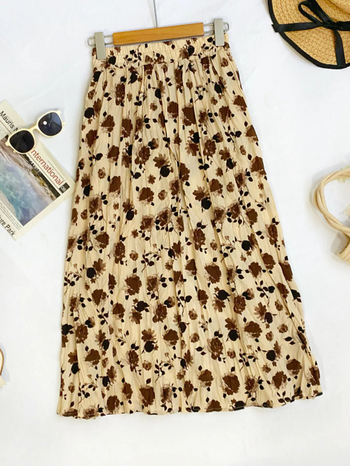 Floral print elastic waist midi skirt by Plush Fashion Hub, showcasing vibrant floral patterns and flowing fabric.