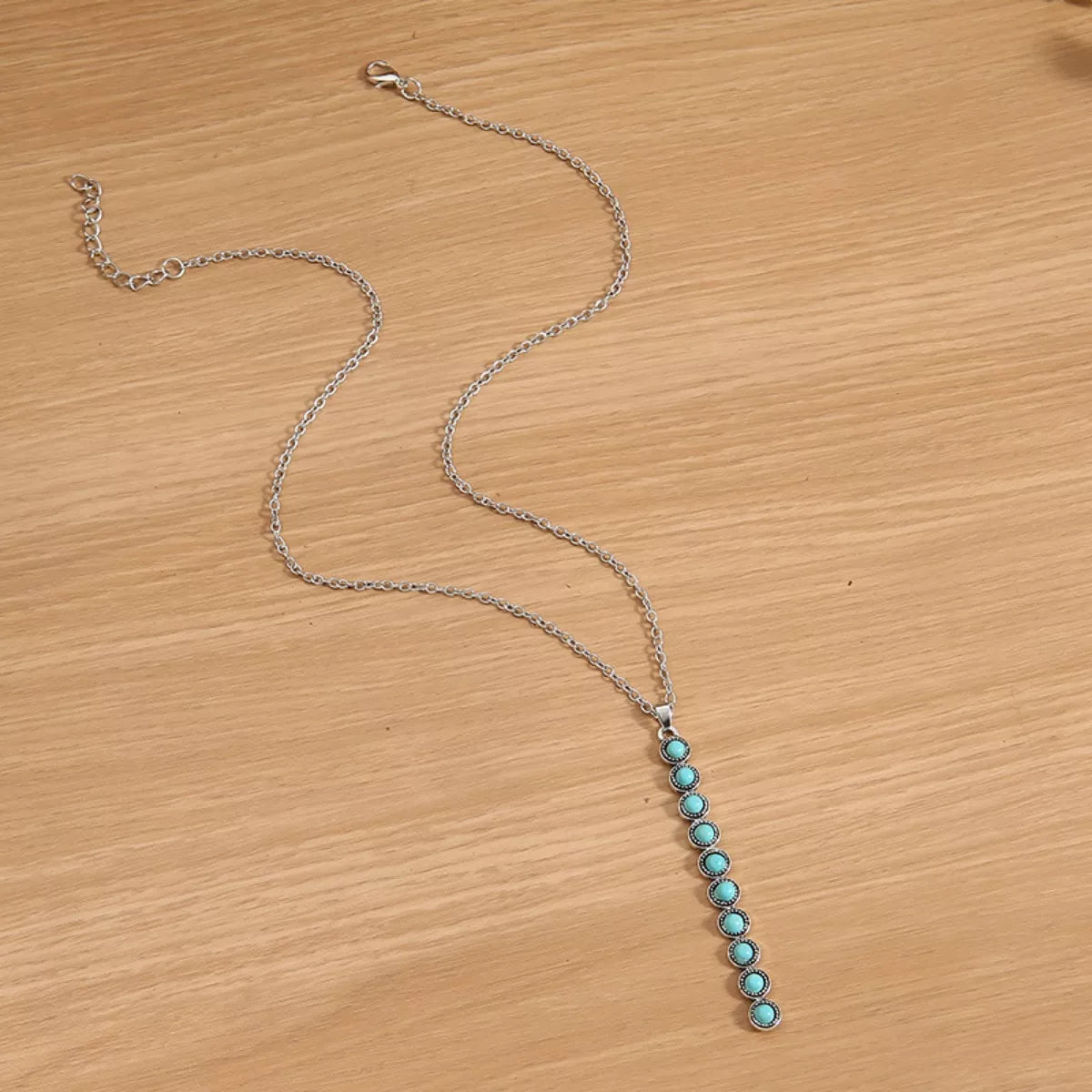 Vintage style beaded bar necklace with colorful beads on a silver chain, jewelry by Plush Fashion Hub.
