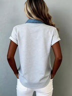 Denim trim short sleeve shirt from Trendsi, casual tops with button closure and denim accents, displayed on a hanger.
