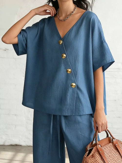 Plus size Trendsi surplice half sleeve top with wide-leg pants set, featuring comfortable fabric and stylish design.