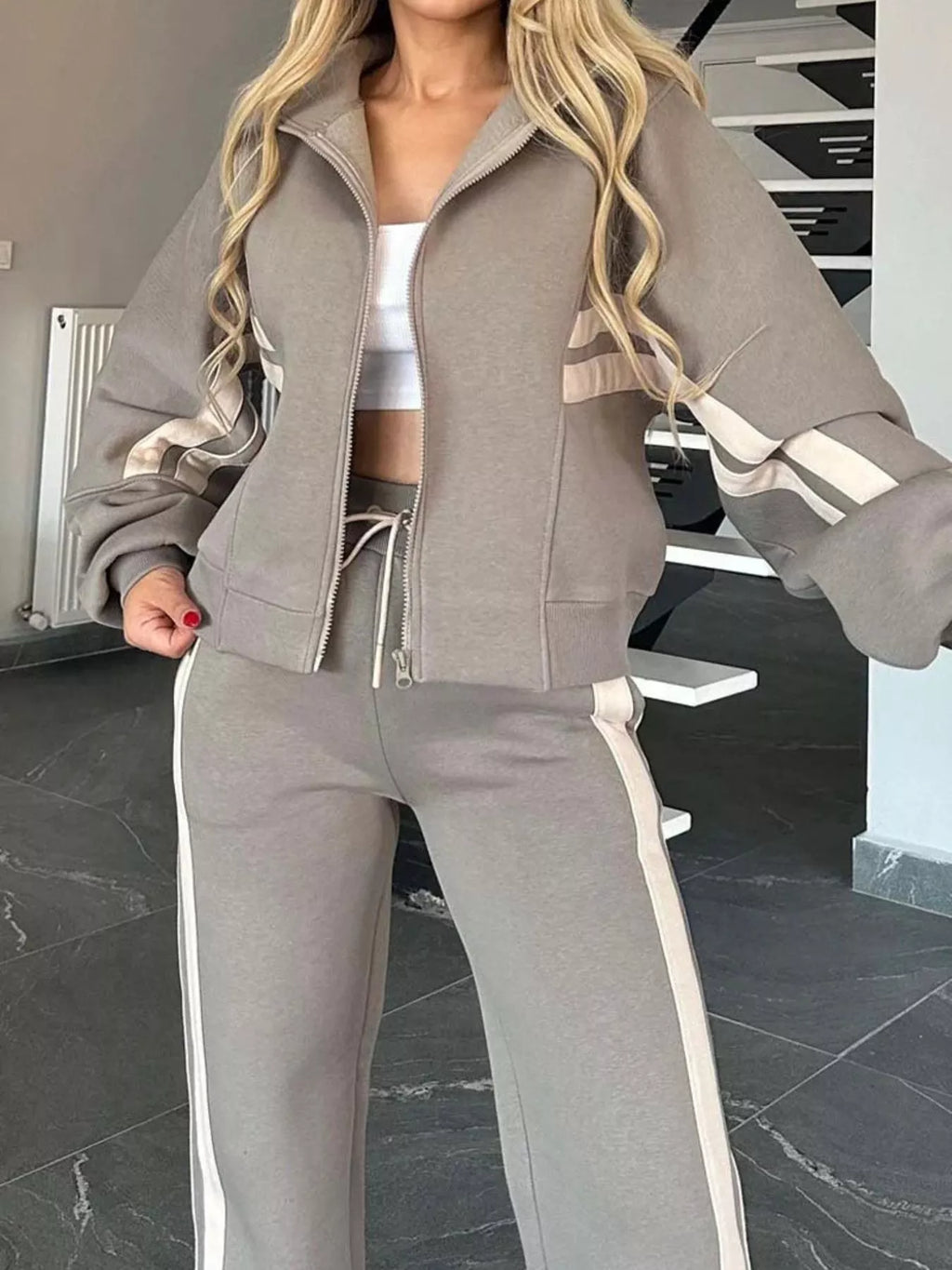 Plus size contrast stripe zip-up activewear jacket and pants set by Plush Fashion Hub, featuring bold color blocking and comfortable fit.