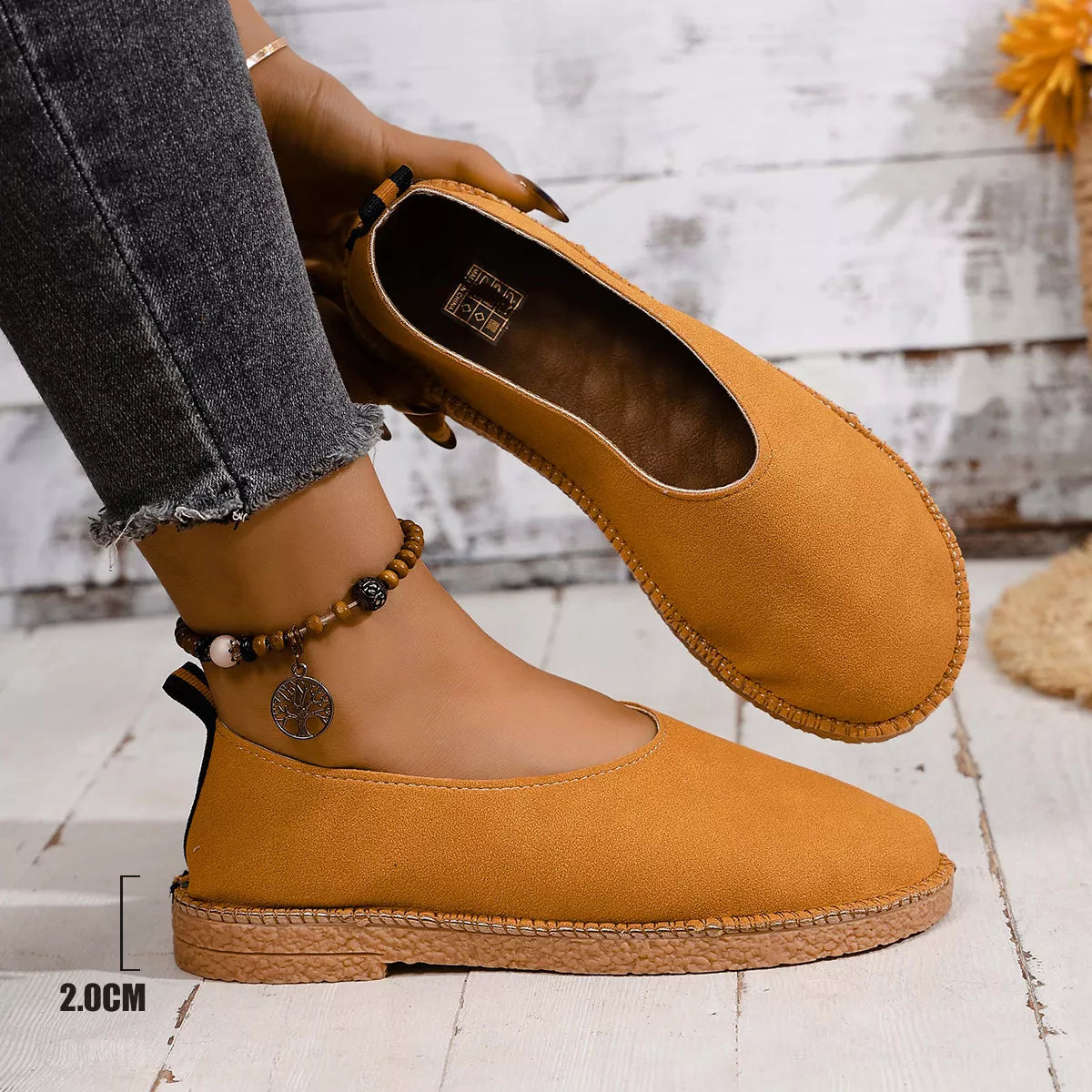 Round toe slip-on flats by Plush Fashion Hub, showcasing a sleek design and comfortable fit in a neutral color.