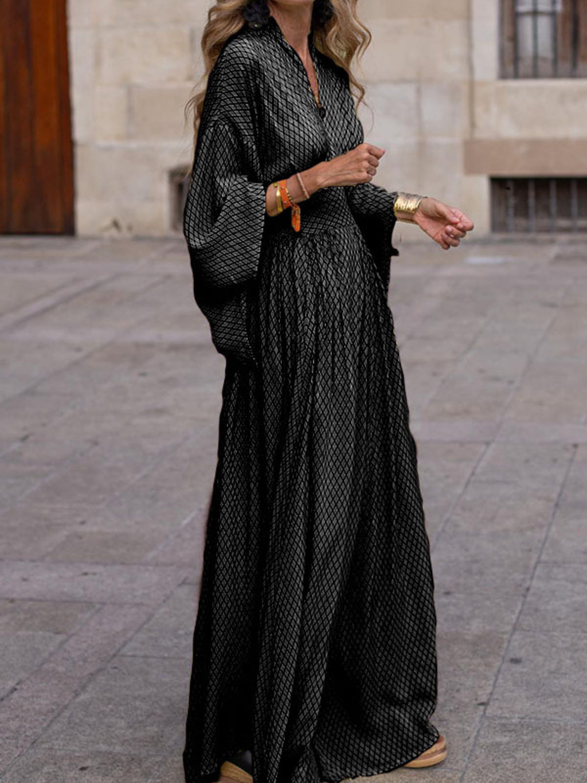 Elegant V-neck maxi dress with flowy sleeves, stylish and comfortable, by Trendsi, perfect for casual or dressy occasions.
