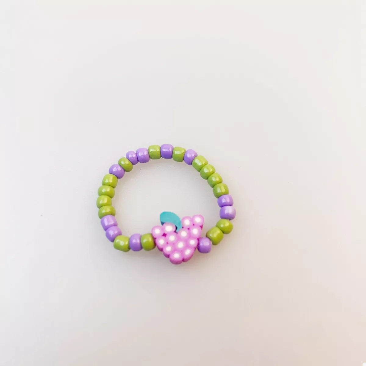 Colorful fruit charm beaded ring from Plush Fashion Hub featuring vibrant fruit-shaped beads and a stylish design.