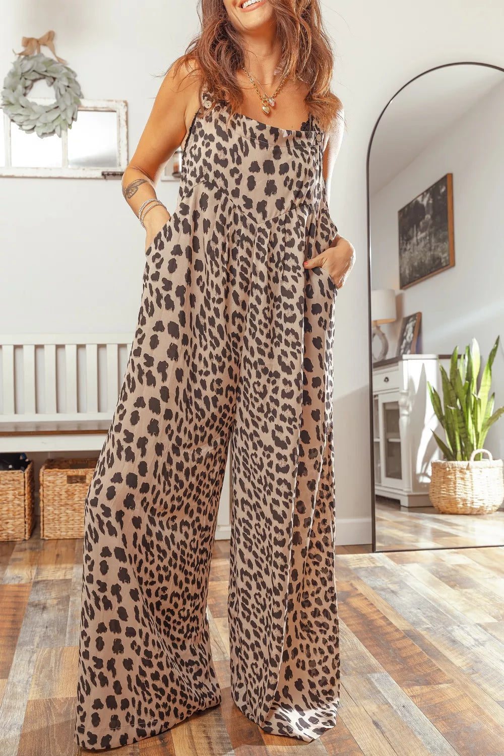 Leopard print square neck pleated wide-leg jumpsuit from Plush Fashion Hub displayed on a model.