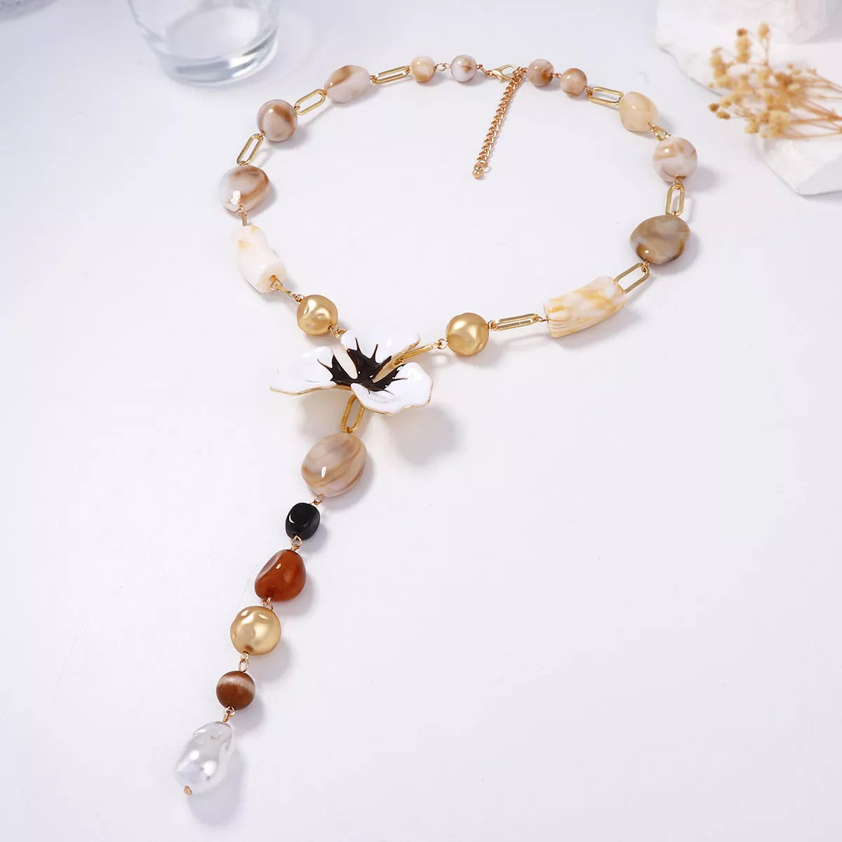 Y-shaped alloy necklace with dripping oil flower resin pendant, stylish jewelry piece by Plush Fashion Hub.