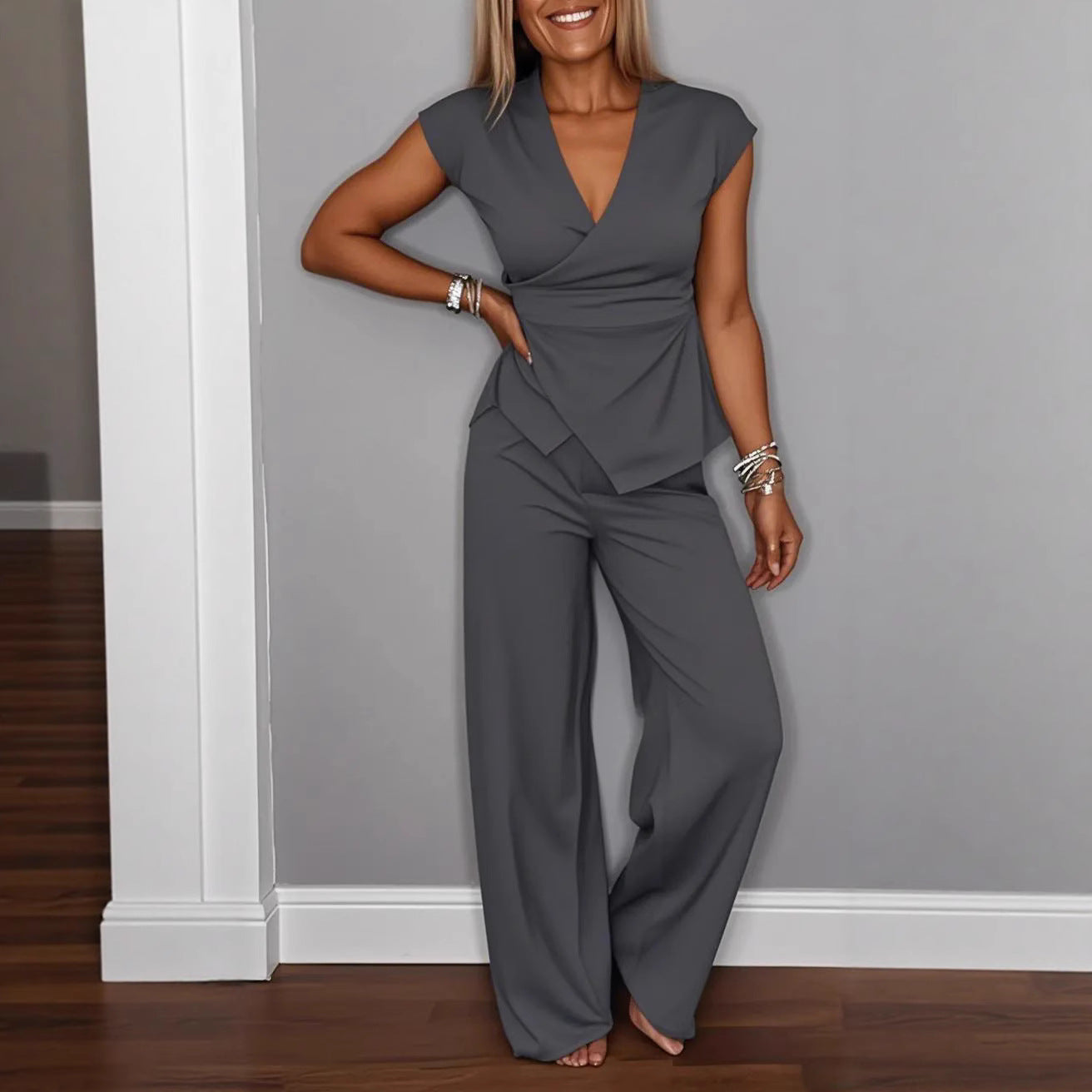 Women's pleated vest and pants set by FitiqueFit featuring metal buckle details, casualwear style with a chic and modern look.