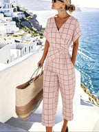 Women's loose irregular short-sleeve two-piece casualwear set by FitiqueFit, featuring a relaxed fit top and matching shorts.