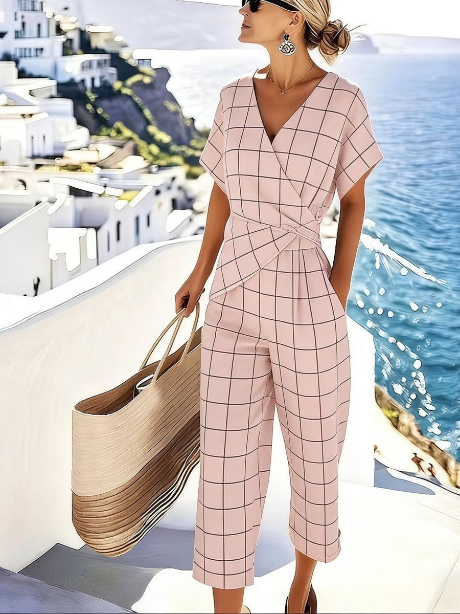 Women's loose irregular short-sleeve two-piece casualwear set by FitiqueFit, featuring a relaxed fit top and matching shorts.